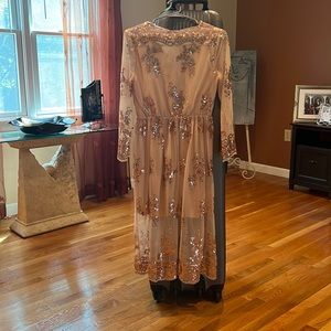 Beautiful never worn sheer womens dress with gold and under slip